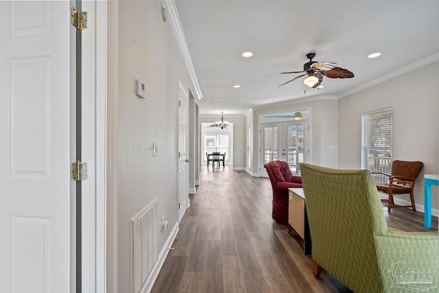 5456 Pensacola Ave, Orange Beach, AL 36561 - hallway featuring wood finished floors, visible vents, crown molding, and baseboards