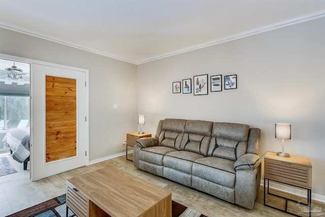 living room with crown molding, ceiling fan, and light hardwood / wood-style floors