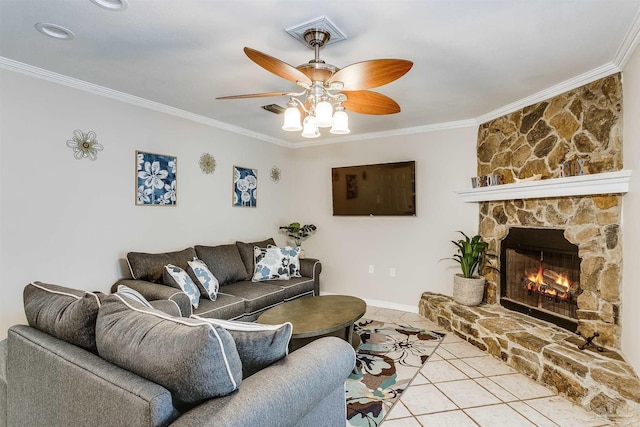 tiled living room featuring ceiling fan, a stone fireplace, and crown molding