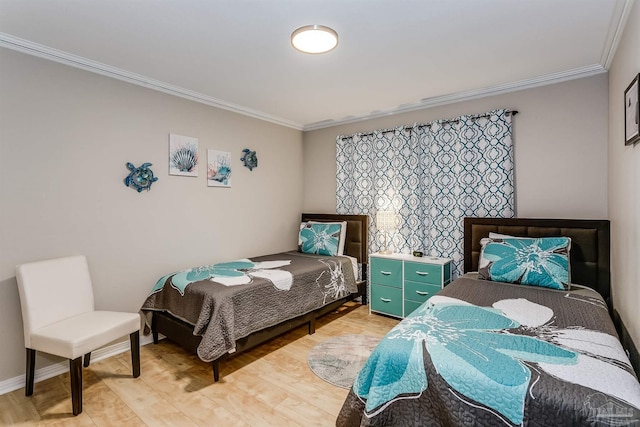 bedroom with hardwood / wood-style flooring and crown molding