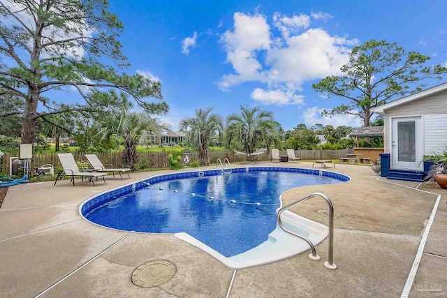 view of swimming pool featuring a patio area