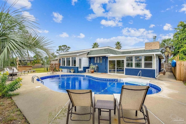 view of pool with a patio area and a jacuzzi