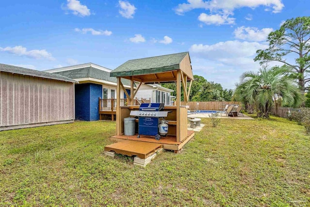 view of yard featuring a swimming pool side deck