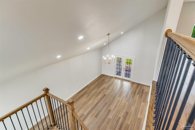 interior space with baseboards, french doors, recessed lighting, and wood finished floors