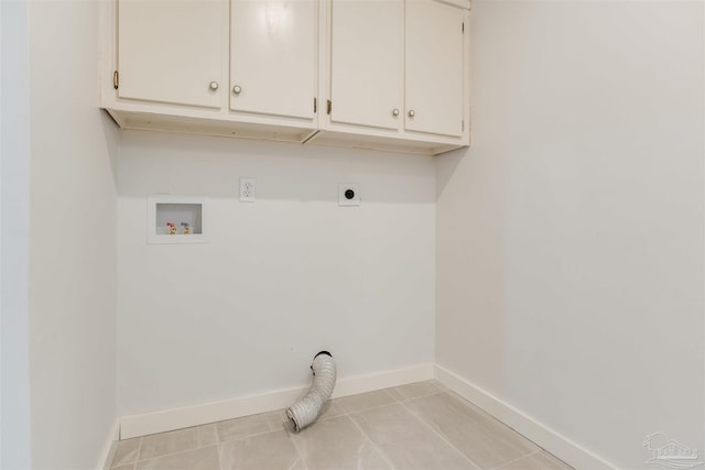 washroom with washer hookup, hookup for an electric dryer, baseboards, and cabinet space