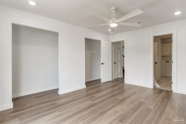 unfurnished bedroom featuring light wood-style floors and baseboards