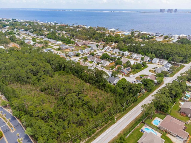 bird's eye view featuring a water view and a residential view