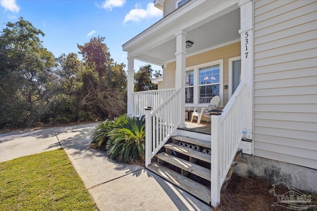 property entrance with covered porch