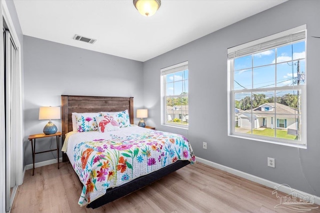 bedroom featuring a closet and hardwood / wood-style flooring