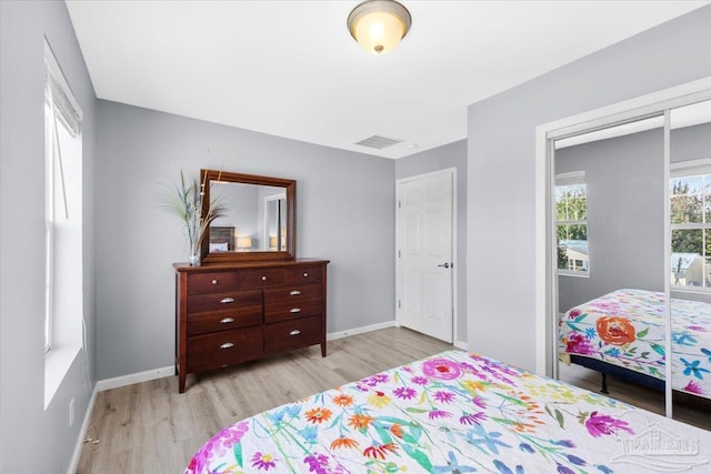 bedroom with a closet and light wood-type flooring