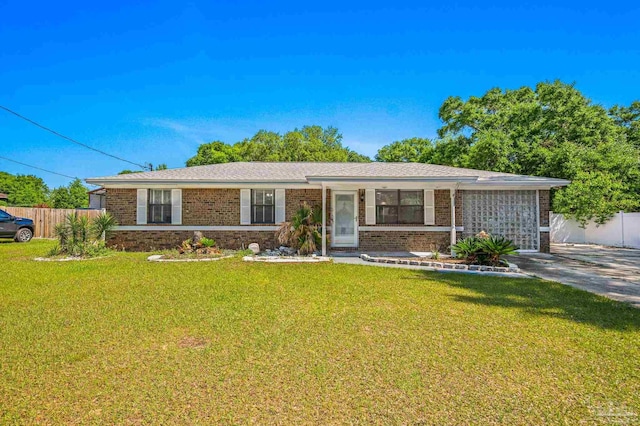 single story home with a front lawn, brick siding, and fence
