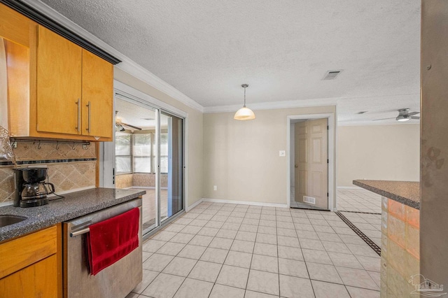 kitchen featuring visible vents, baseboards, backsplash, dishwasher, and ornamental molding