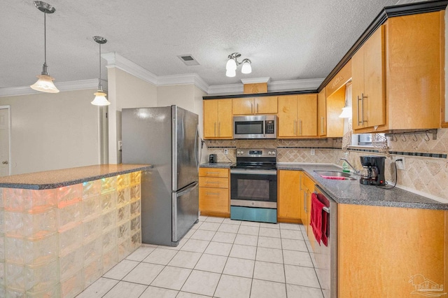 kitchen with a sink, dark countertops, appliances with stainless steel finishes, decorative backsplash, and ornamental molding