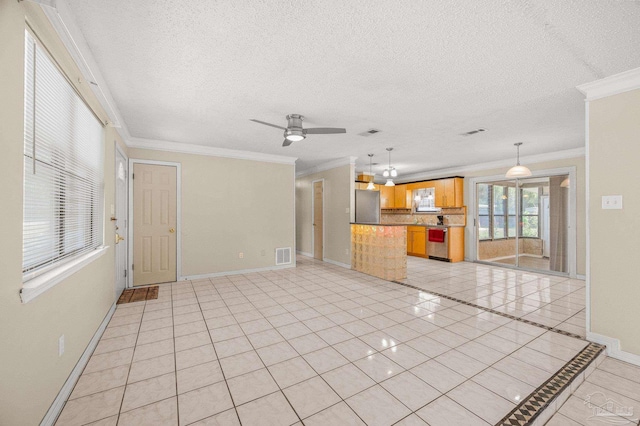 unfurnished living room with light tile patterned floors, a textured ceiling, visible vents, baseboards, and ornamental molding