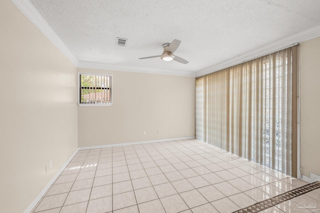 empty room with ceiling fan, a textured ceiling, crown molding, and visible vents