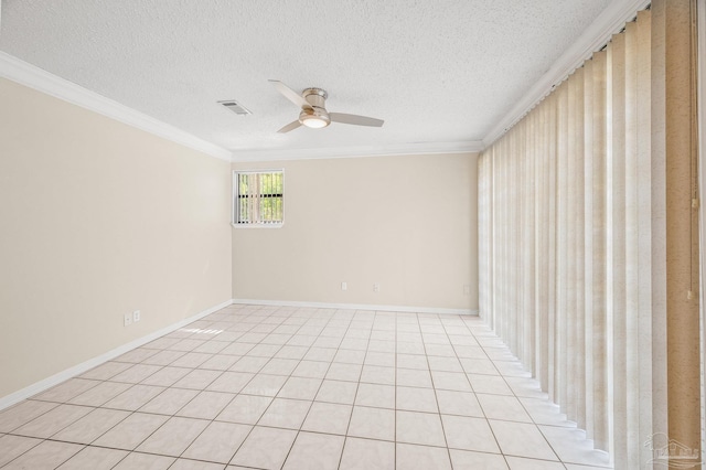 unfurnished room featuring a ceiling fan, a textured ceiling, visible vents, baseboards, and ornamental molding