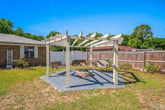 view of yard with an outdoor fire pit, a patio, a pergola, and a fenced backyard