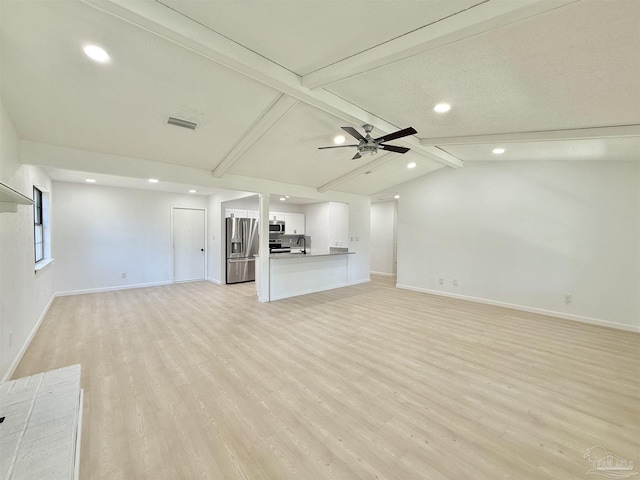 unfurnished living room featuring light wood-type flooring, baseboards, visible vents, and recessed lighting