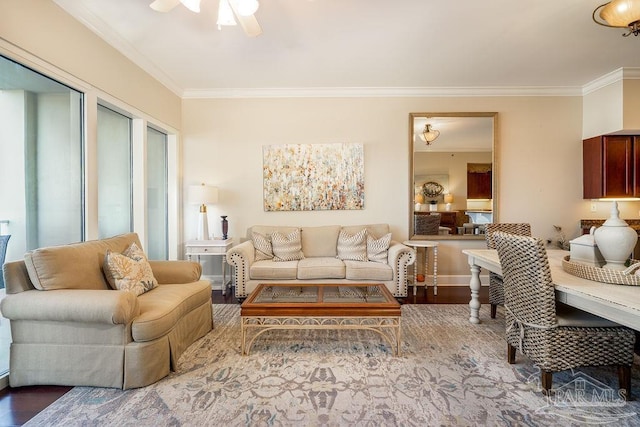 living room with ceiling fan, wood finished floors, and crown molding