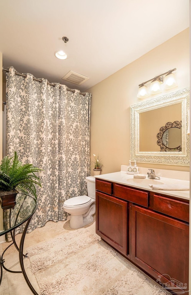 full bath with visible vents, a shower with shower curtain, toilet, tile patterned floors, and vanity