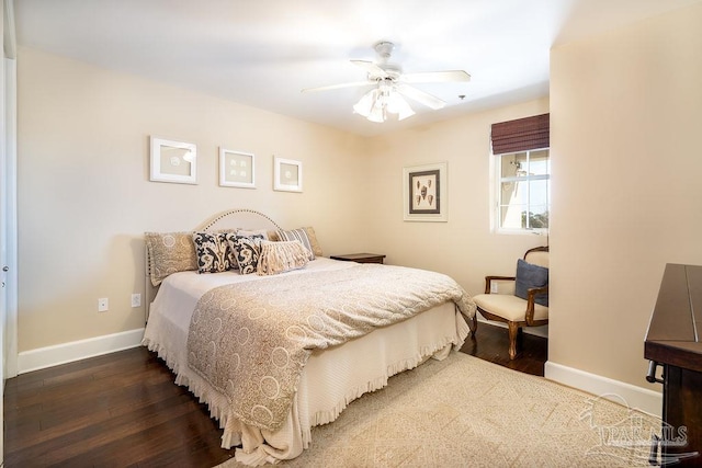 bedroom featuring ceiling fan, baseboards, and dark wood finished floors