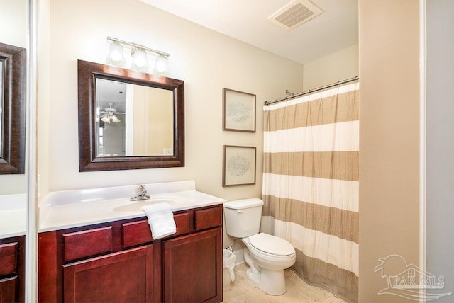 bathroom with tile patterned flooring, toilet, vanity, visible vents, and a shower with curtain