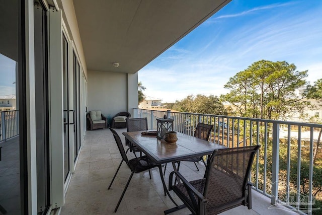 balcony featuring outdoor dining area