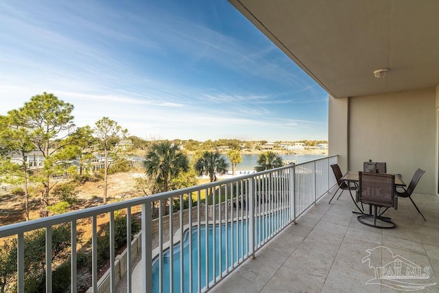 balcony featuring a water view