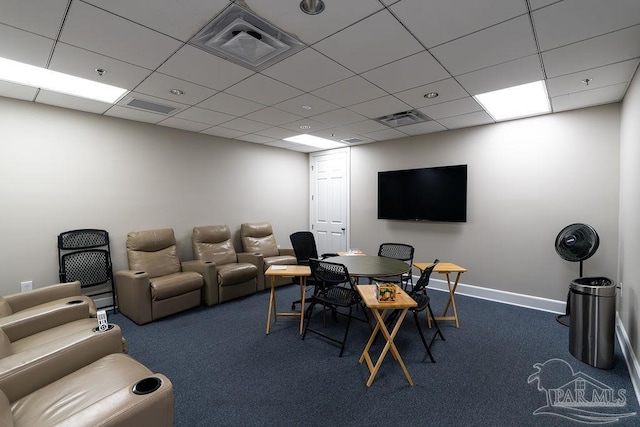 carpeted home office featuring a drop ceiling, visible vents, and baseboards