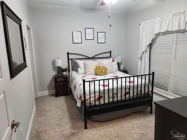 bedroom featuring ceiling fan and light colored carpet