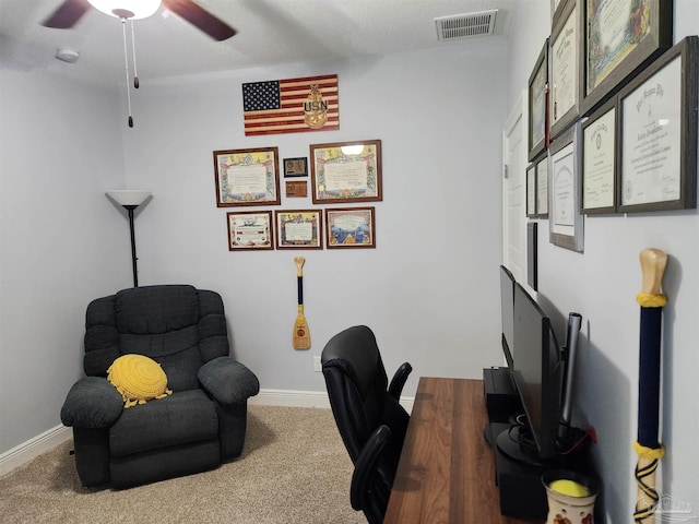 office space featuring ceiling fan and carpet floors