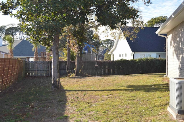 view of yard with central air condition unit