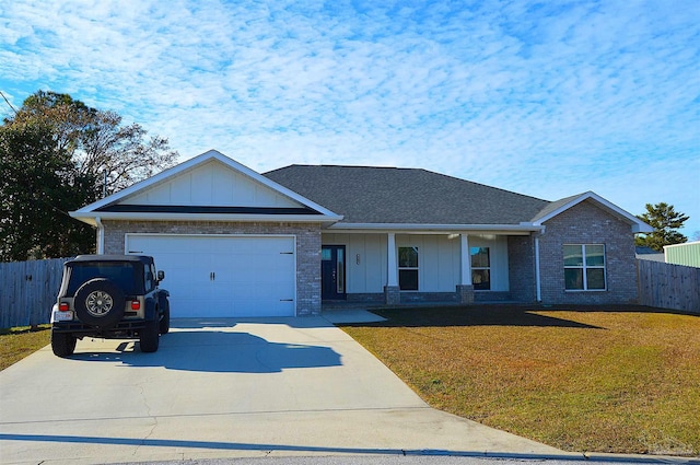 single story home with a front yard and a garage