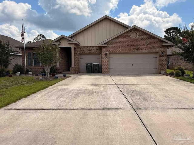7912 Stream Ridge Rd, Pensacola, FL 32526 - single story home with board and batten siding, brick siding, concrete driveway, and an attached garage
