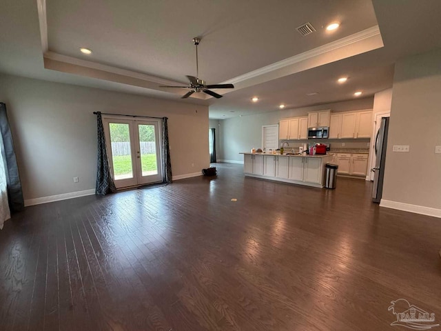 7912 Stream Ridge Rd, Pensacola, FL 32526 - unfurnished living room featuring a raised ceiling, crown molding, baseboards, dark wood finished floors, and a ceiling fan