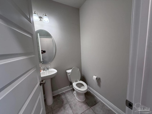 7912 Stream Ridge Rd, Pensacola, FL 32526 - half bath with toilet, tile patterned floors, baseboards, and a sink