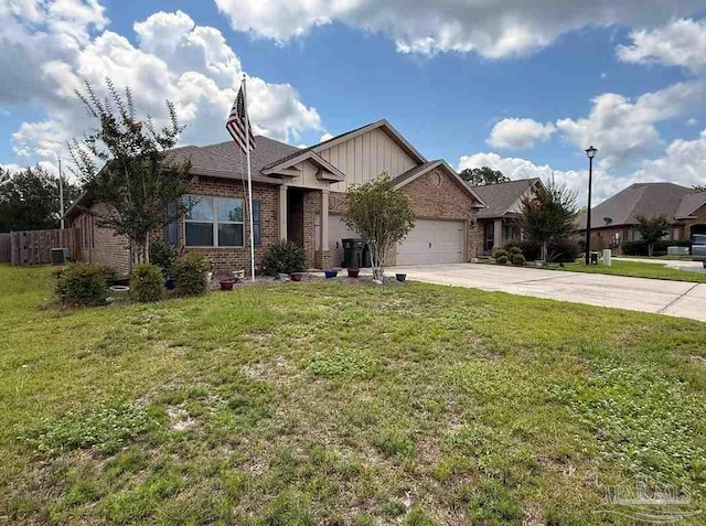 7912 Stream Ridge Rd, Pensacola, FL 32526 - view of front of house featuring brick siding, concrete driveway, a garage, and a front yard
