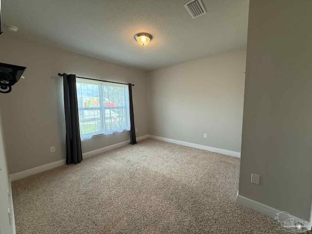 7912 Stream Ridge Rd, Pensacola, FL 32526 - unfurnished room featuring light carpet, baseboards, and a textured ceiling