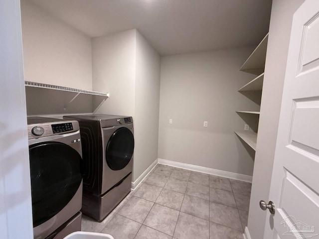 7912 Stream Ridge Rd, Pensacola, FL 32526 - laundry area with independent washer and dryer, light tile patterned flooring, and baseboards