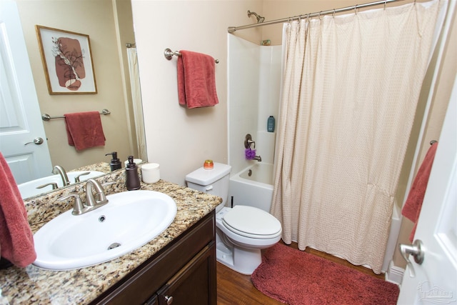 full bathroom featuring vanity, toilet, shower / bathtub combination with curtain, and hardwood / wood-style flooring