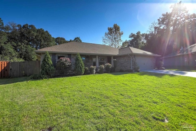 ranch-style house with a front yard and a garage