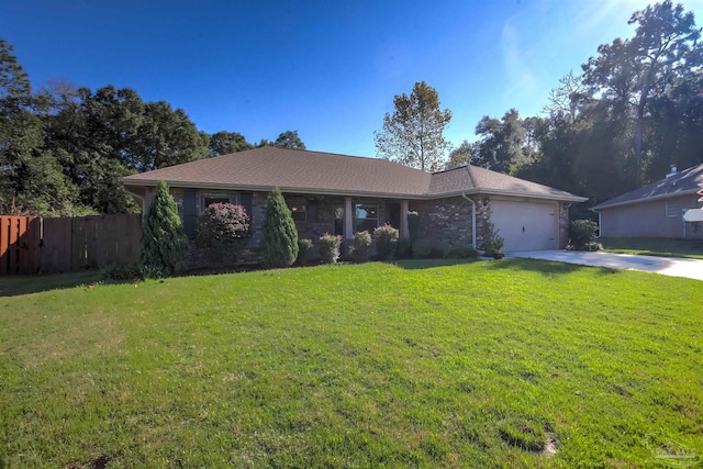 ranch-style home featuring a garage and a front lawn