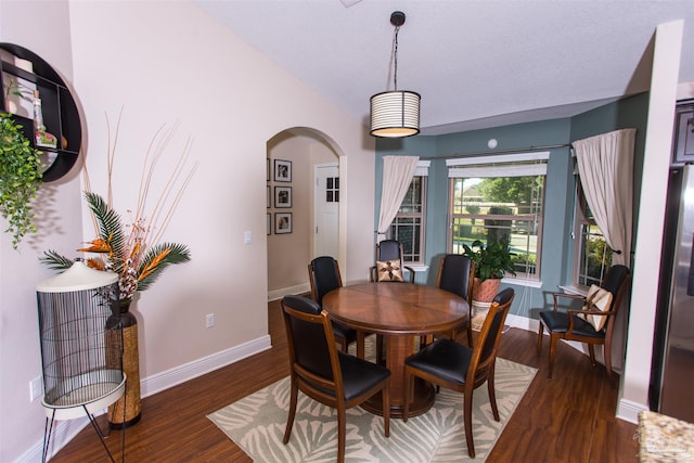 dining space featuring dark hardwood / wood-style flooring