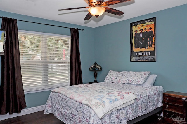 bedroom with dark wood-type flooring and ceiling fan