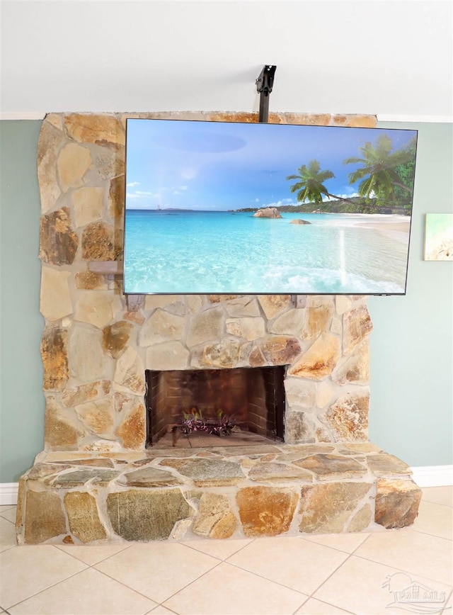 exterior details with a stone fireplace and tile patterned flooring