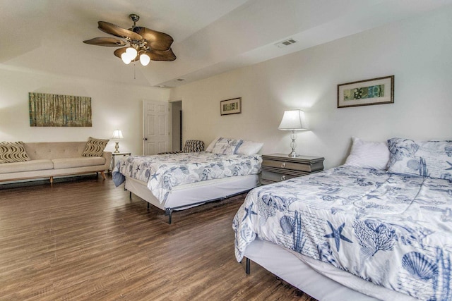 bedroom with dark wood-type flooring and ceiling fan