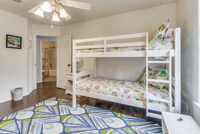 bedroom with ceiling fan and dark hardwood / wood-style flooring