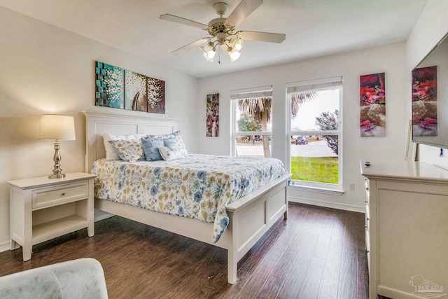 bedroom with dark wood-type flooring and ceiling fan