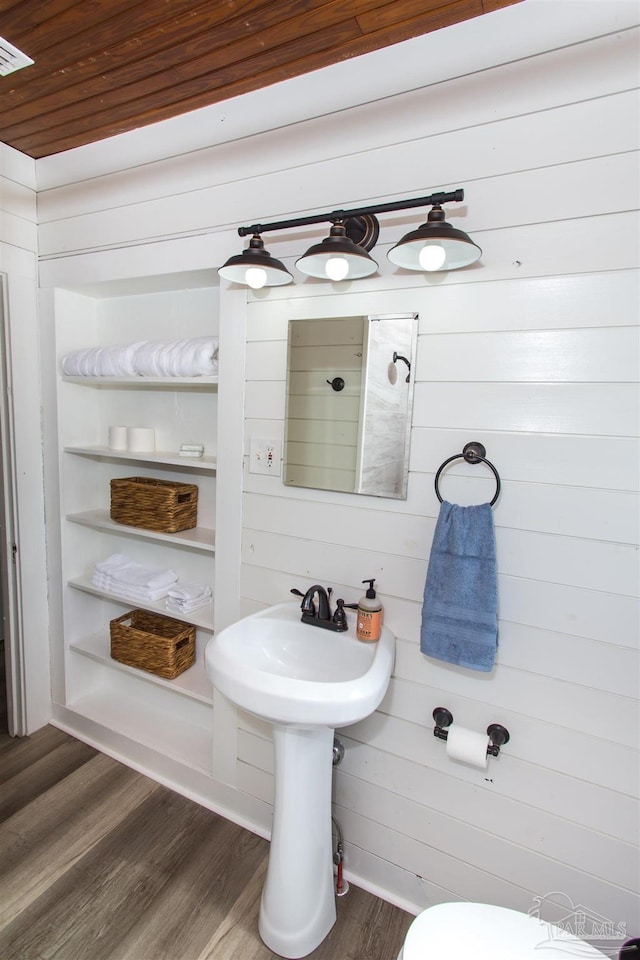 bathroom featuring wooden ceiling, wood finished floors, and visible vents