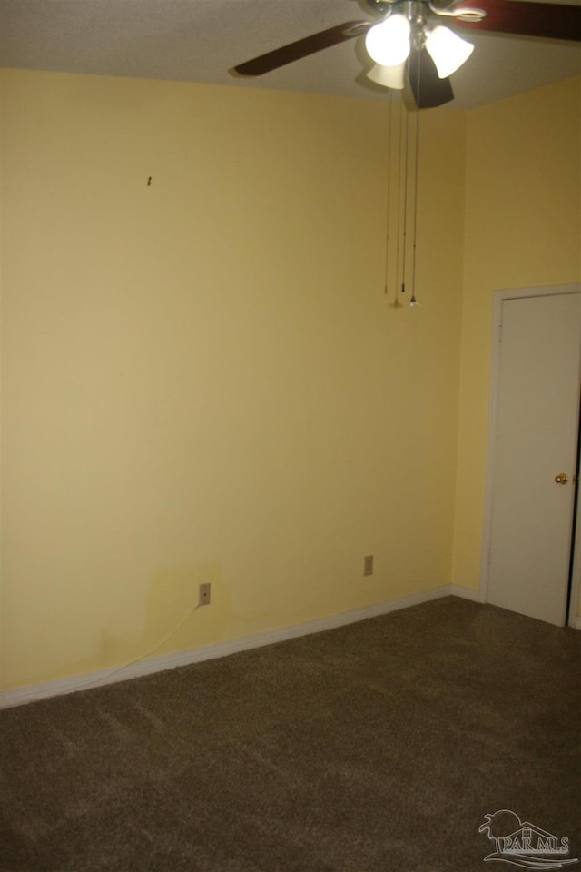 spare room with ceiling fan and carpet floors